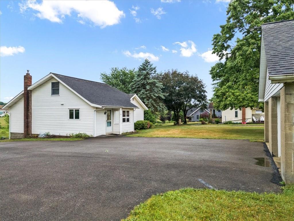 681 Herman Road Butler, PA 16002 - Photo 26 of 28 a view of a house with a yard and large tree