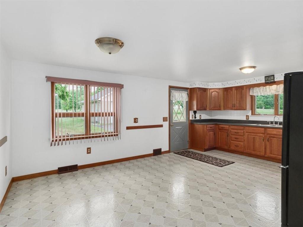 681 Herman Road Butler, PA 16002 - Photo 4 of 28 a view of kitchen with window and refrigerator