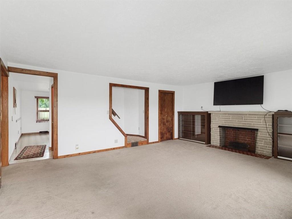 681 Herman Road Butler, PA 16002 - Photo 6 of 28 a view of empty room with a fireplace