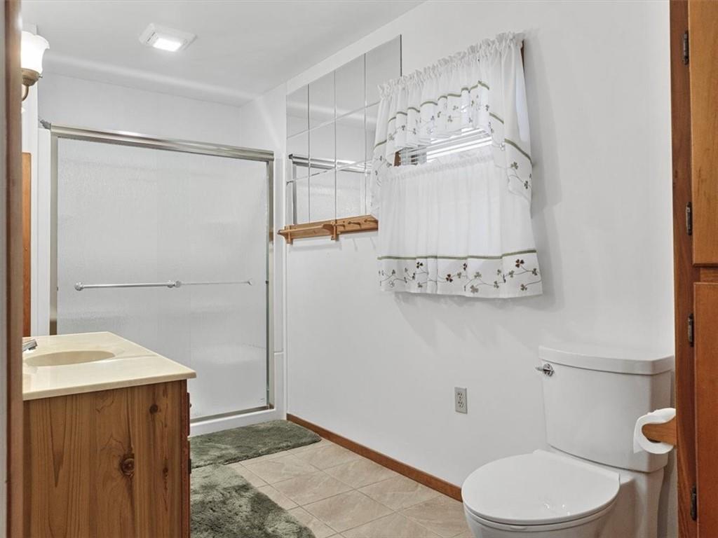 681 Herman Road Butler, PA 16002 - Photo 9 of 28 a bathroom with a toilet and a shower