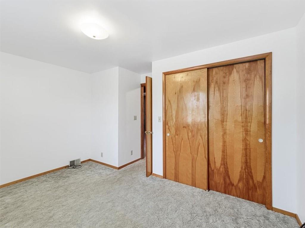 681 Herman Road Butler, PA 16002 - Photo 10 of 28 an empty room with a sliding door