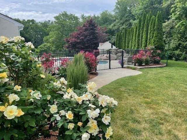 112 River Road Hanover, MA 02339 - Photo 37 of 42 a view of a garden with flowers and trees