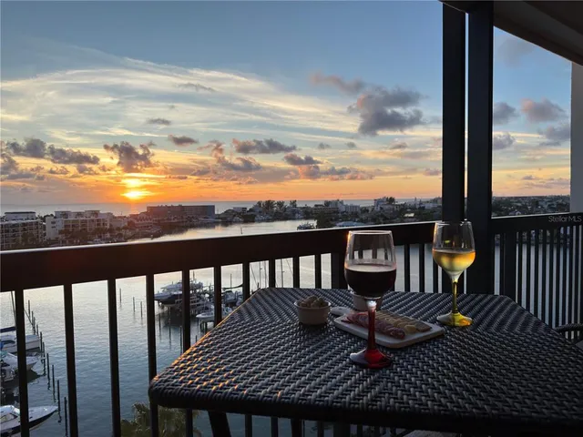 a view of a balcony with wooden floor