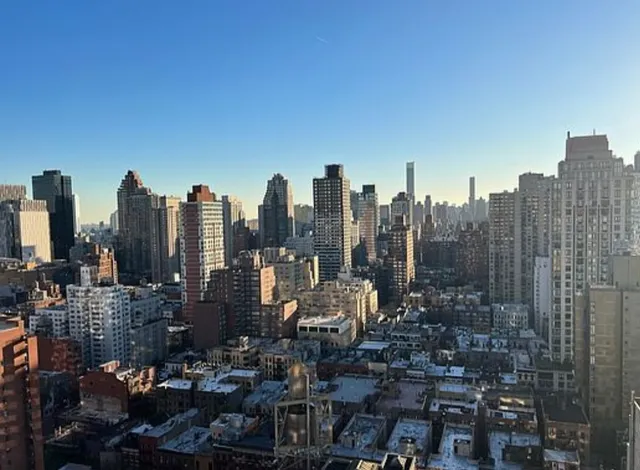 a view of a city with tall buildings