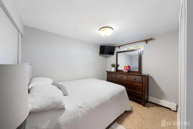 a bathroom with a toilet sink a mirror and shower