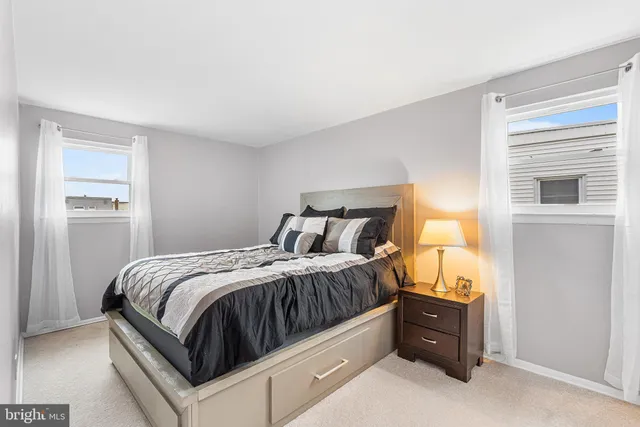 a bedroom with a bed and a closet