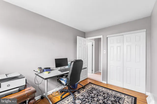 a view of workspace with wooden floor and chair