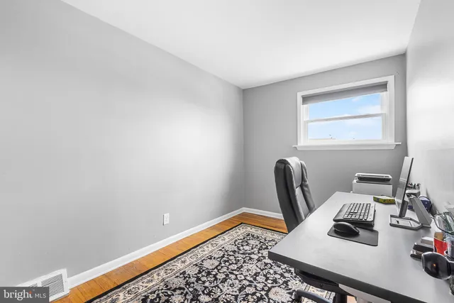 a bathroom with a sink vanity mirror and toilet