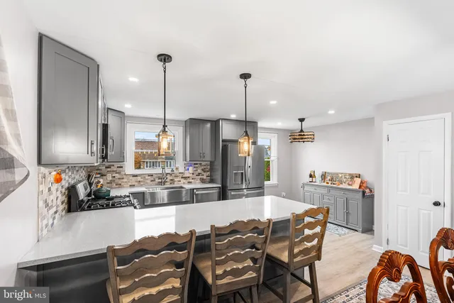 a dining room with furniture and wooden floor