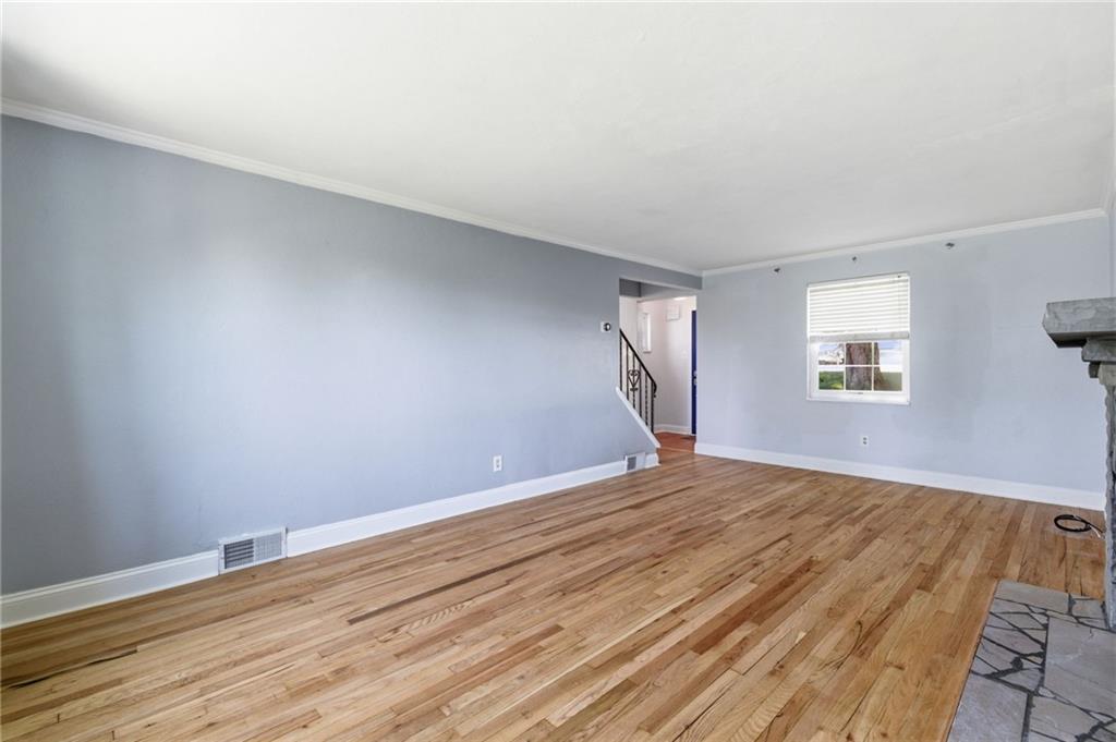 4883 East Willock Road Pittsburgh, PA 15227 - Photo 16 of 33 a view of empty room with wooden floor and fan