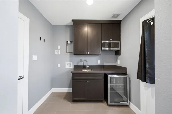 a kitchen with a sink and cabinets