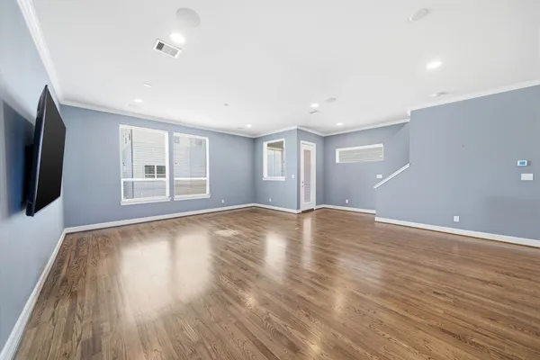 a view of kitchen with wooden floor and window