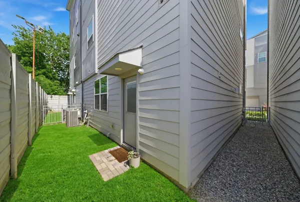 a view of a backyard with sitting area