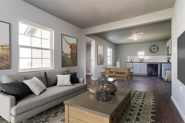 a living room with furniture and a fireplace
