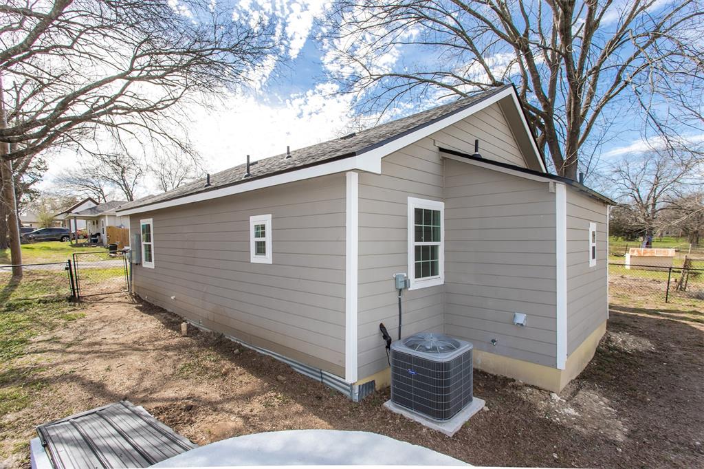 300 South 3rd Street Bonham, TX 75418 - Photo 12 of 14 a view of a patio with a yard