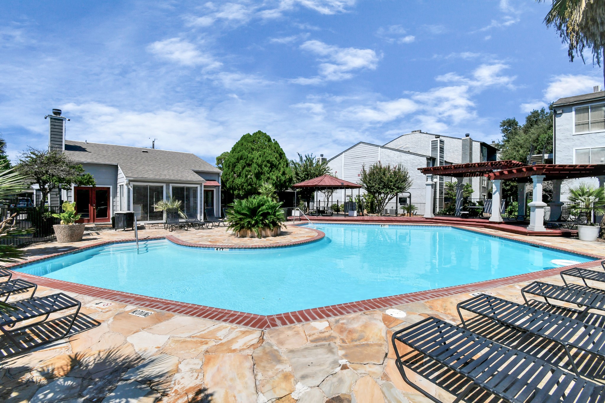 5959 Bonhomme Road, Unit 204R Houston, TX 77036 - Photo 1 of 27 a view of a swimming pool with a patio