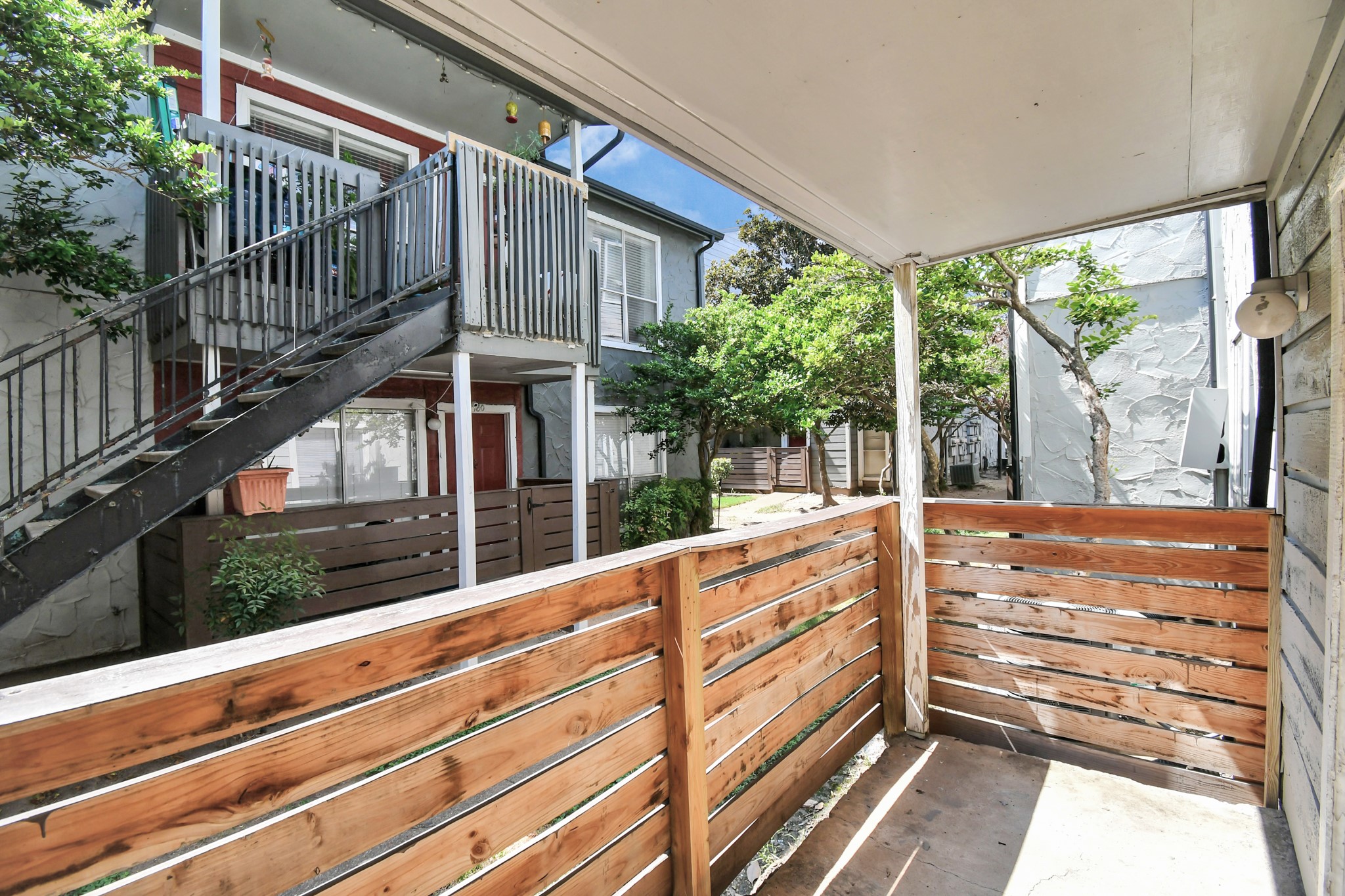 5959 Bonhomme Road, Unit 204R Houston, TX 77036 - Photo 3 of 27 a view of balcony with small yard
