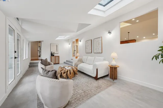 a living room with furniture and a couch