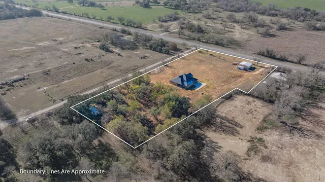 an aerial view of a house with a outdoor space