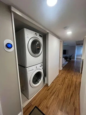 a view of a hallway with washer and dryer