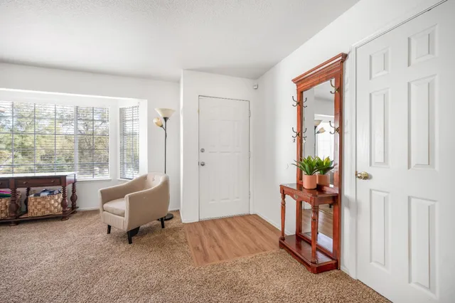 a bedroom with furniture and a window