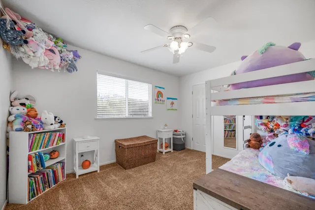 a living room with furniture and baby toys