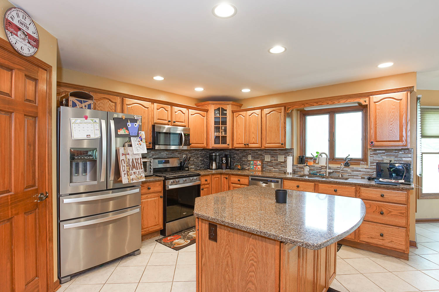 2394 Valley View Drive Kankakee, IL 60901 - Photo 20 of 73 a kitchen with stainless steel appliances granite countertop a refrigerator a sink and a stove