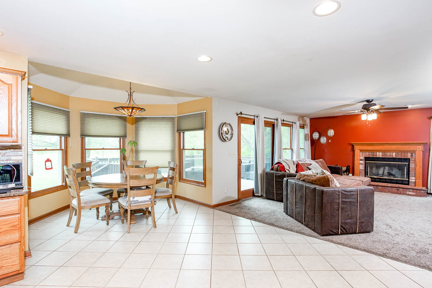 2394 Valley View Drive Kankakee, IL 60901 - Photo 23 of 73 a living room with furniture a flat screen tv and a fireplace