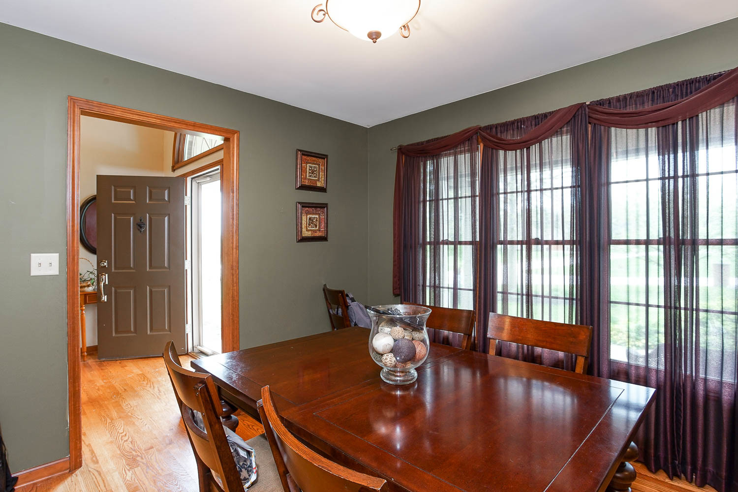 2394 Valley View Drive Kankakee, IL 60901 - Photo 28 of 73 a view of a dining room with furniture window and wooden floor