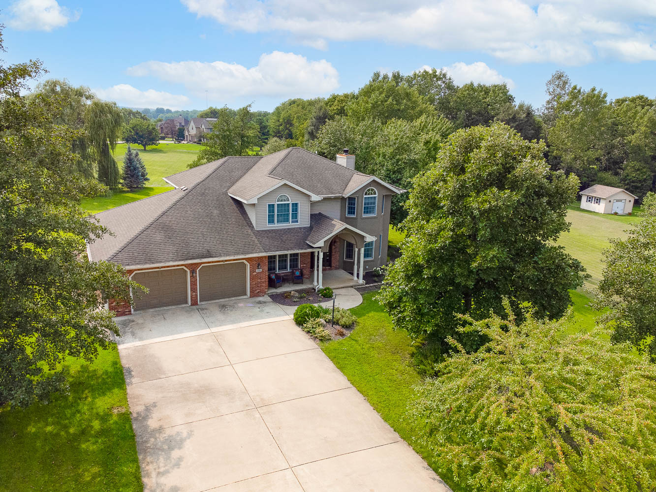 2394 Valley View Drive Kankakee, IL 60901 - Photo 3 of 73 a front view of a house with a yard and mountain view in back