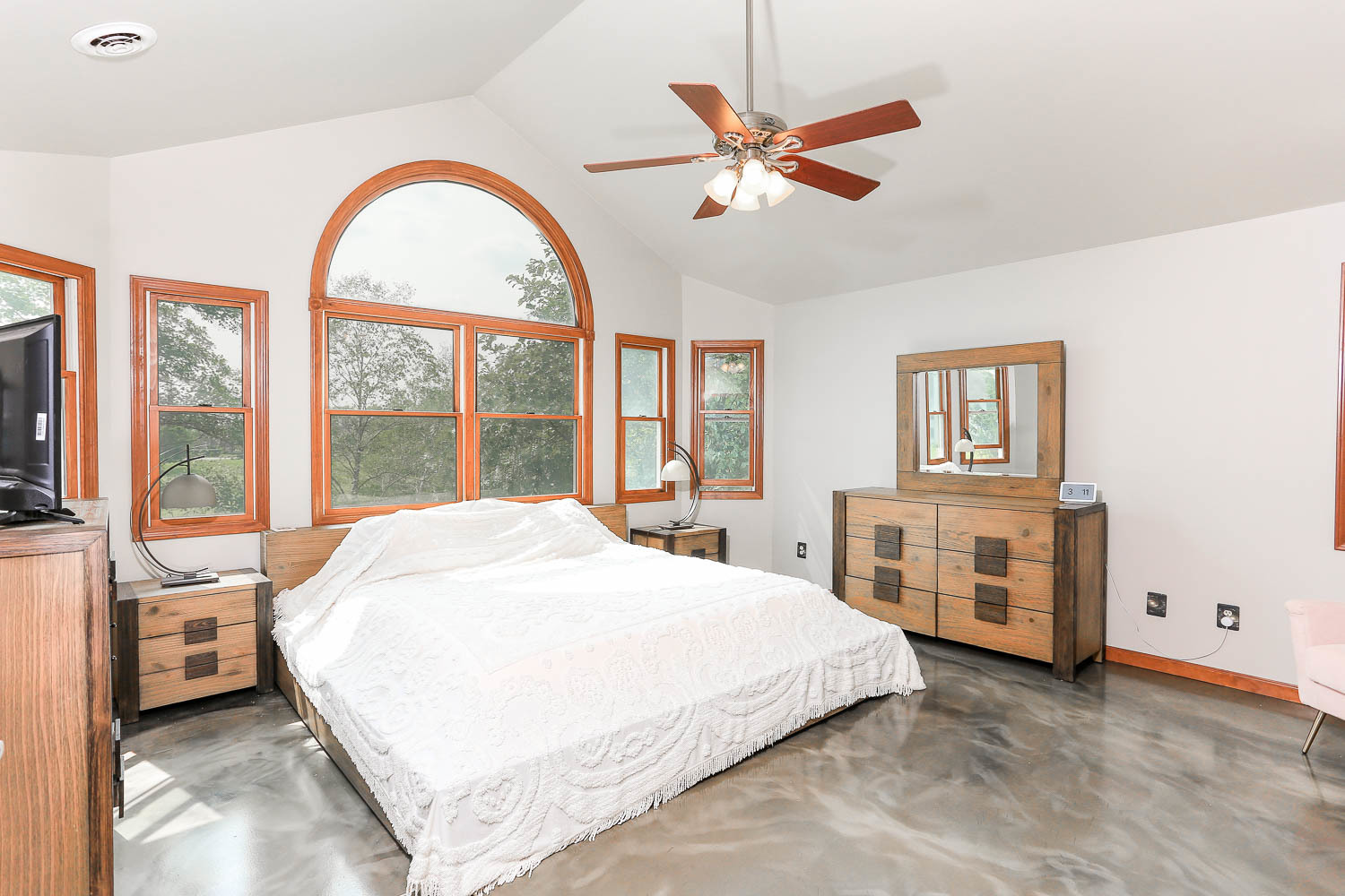 2394 Valley View Drive Kankakee, IL 60901 - Photo 36 of 73 a spacious bedroom with a large bed and a chandelier