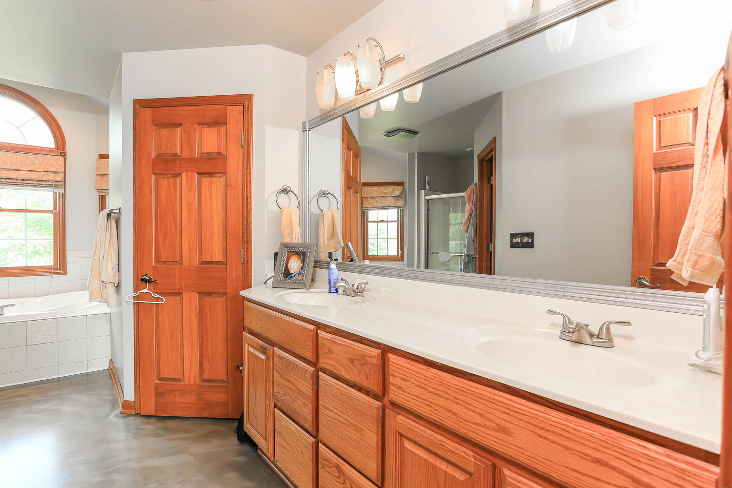 2394 Valley View Drive Kankakee, IL 60901 - Photo 39 of 73 a bathroom with a granite countertop sink and a mirror
