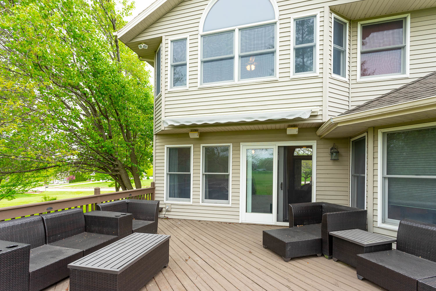 2394 Valley View Drive Kankakee, IL 60901 - Photo 59 of 73 a view of a deck with couches floor to ceiling window with wooden floor