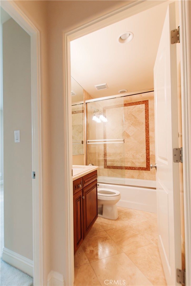 809 20th Street Hermosa Beach, CA 90254 - Photo 33 of 35 a bathroom with a granite countertop sink mirror and a bathtub