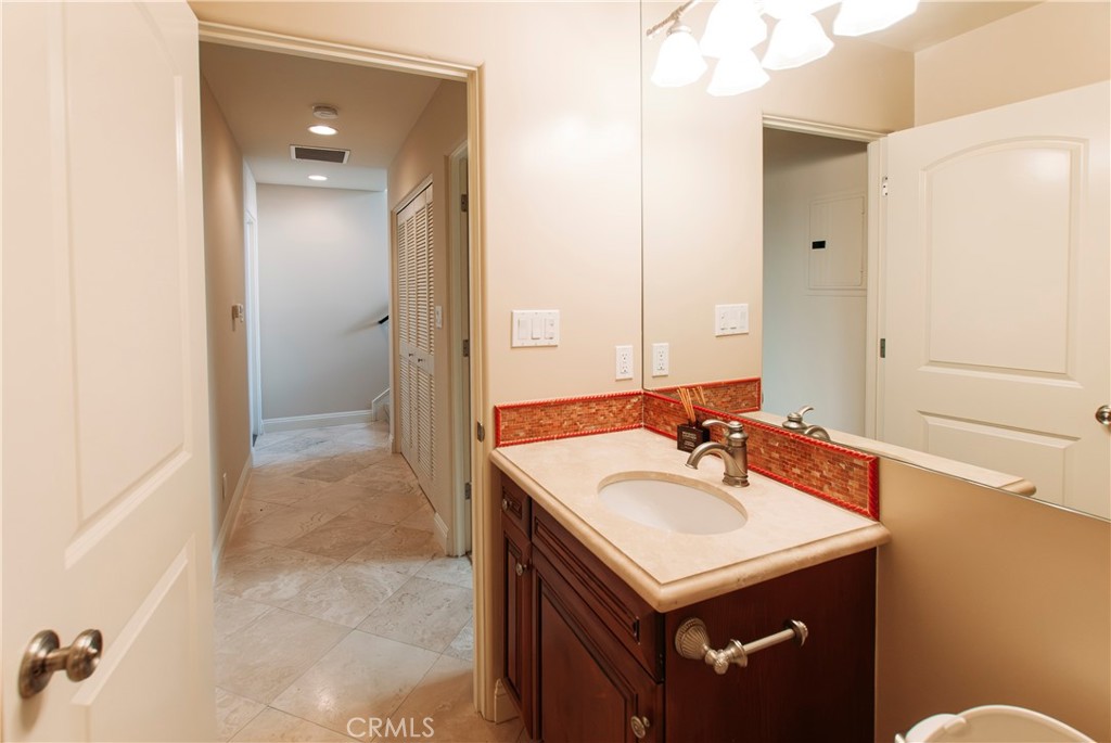 809 20th Street Hermosa Beach, CA 90254 - Photo 34 of 35 a bathroom with a sink and a mirror