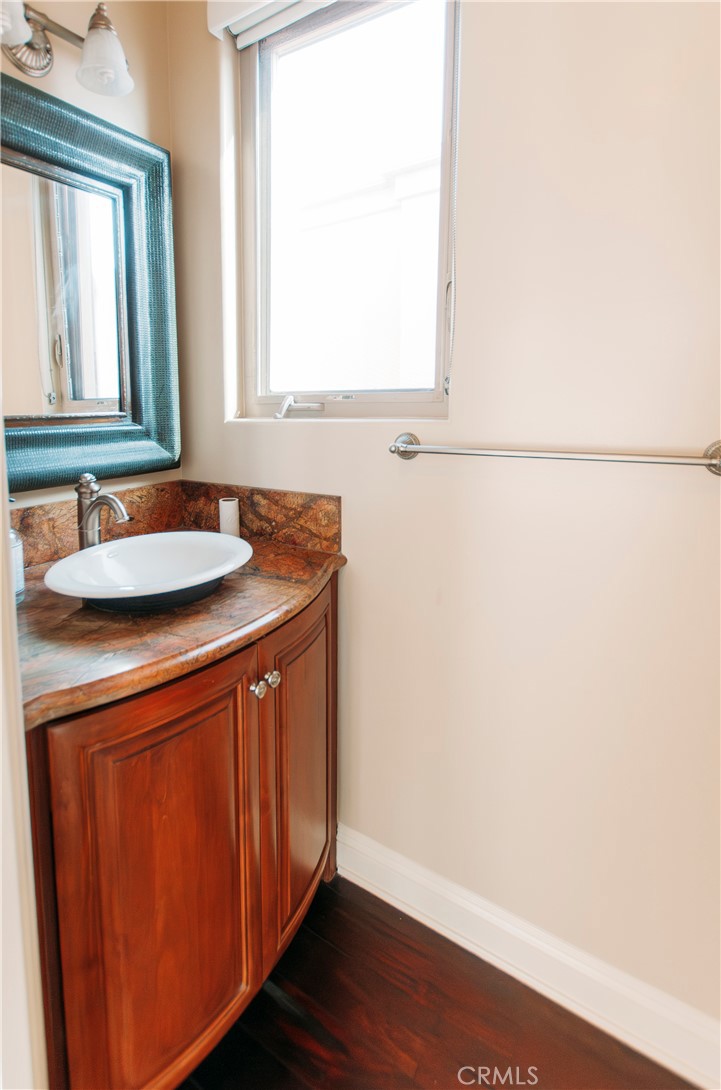 809 20th Street Hermosa Beach, CA 90254 - Photo 8 of 35 a bathroom with a sink and a mirror