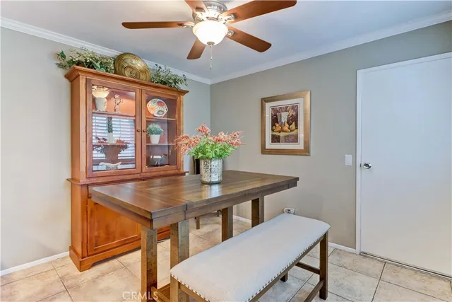 a view of a dining room with furniture and a chandelier