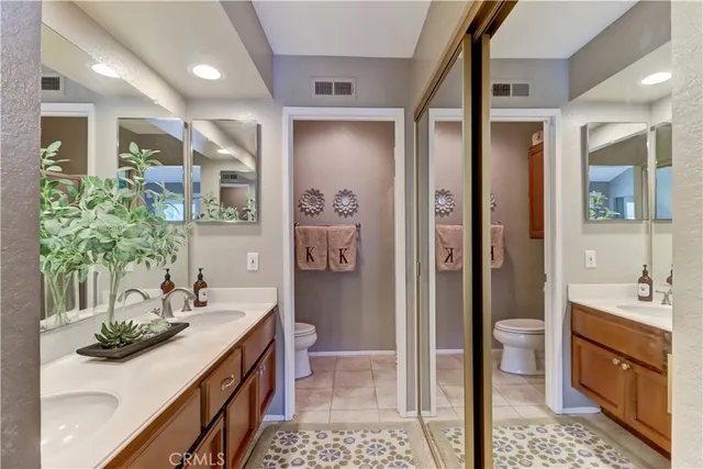 a bathroom with a sink double vanity and a mirror