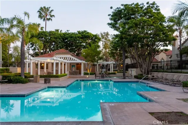an aerial view of a house with a yard and garden