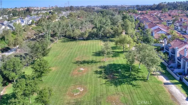 a view of a backyard with sitting area