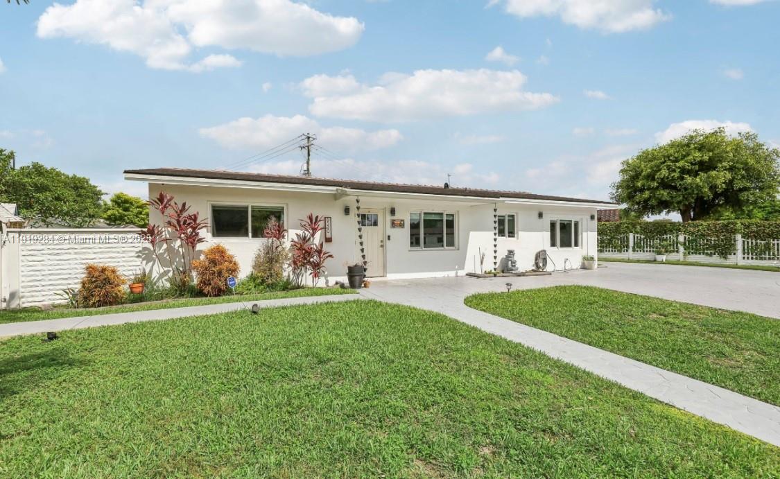 a view of a house with backyard porch and furniture