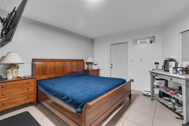 a bed room with a bed and a night stand