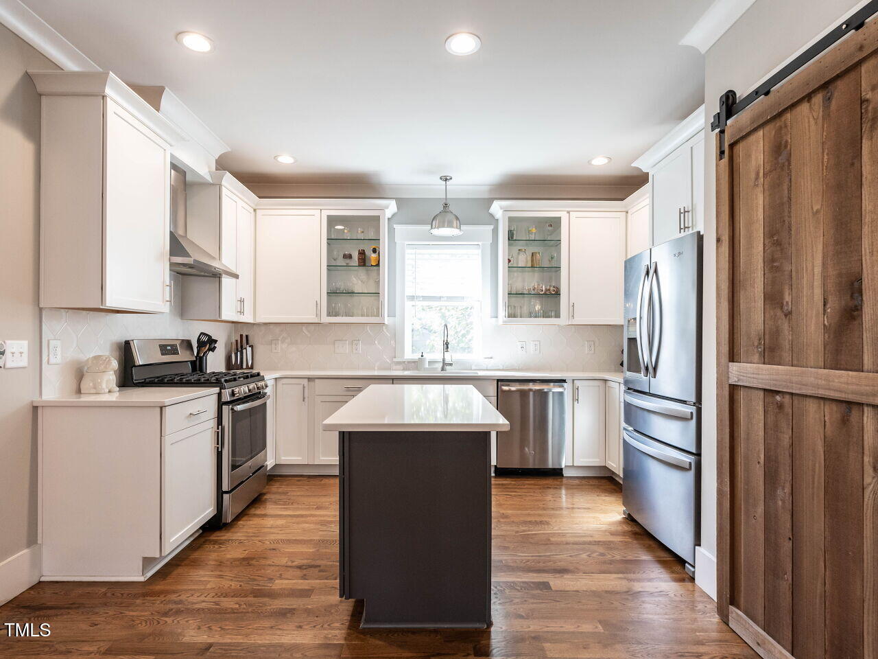 628 Coleman Street Raleigh, NC 27610 - Photo 13 of 38 a kitchen with a refrigerator stove and sink