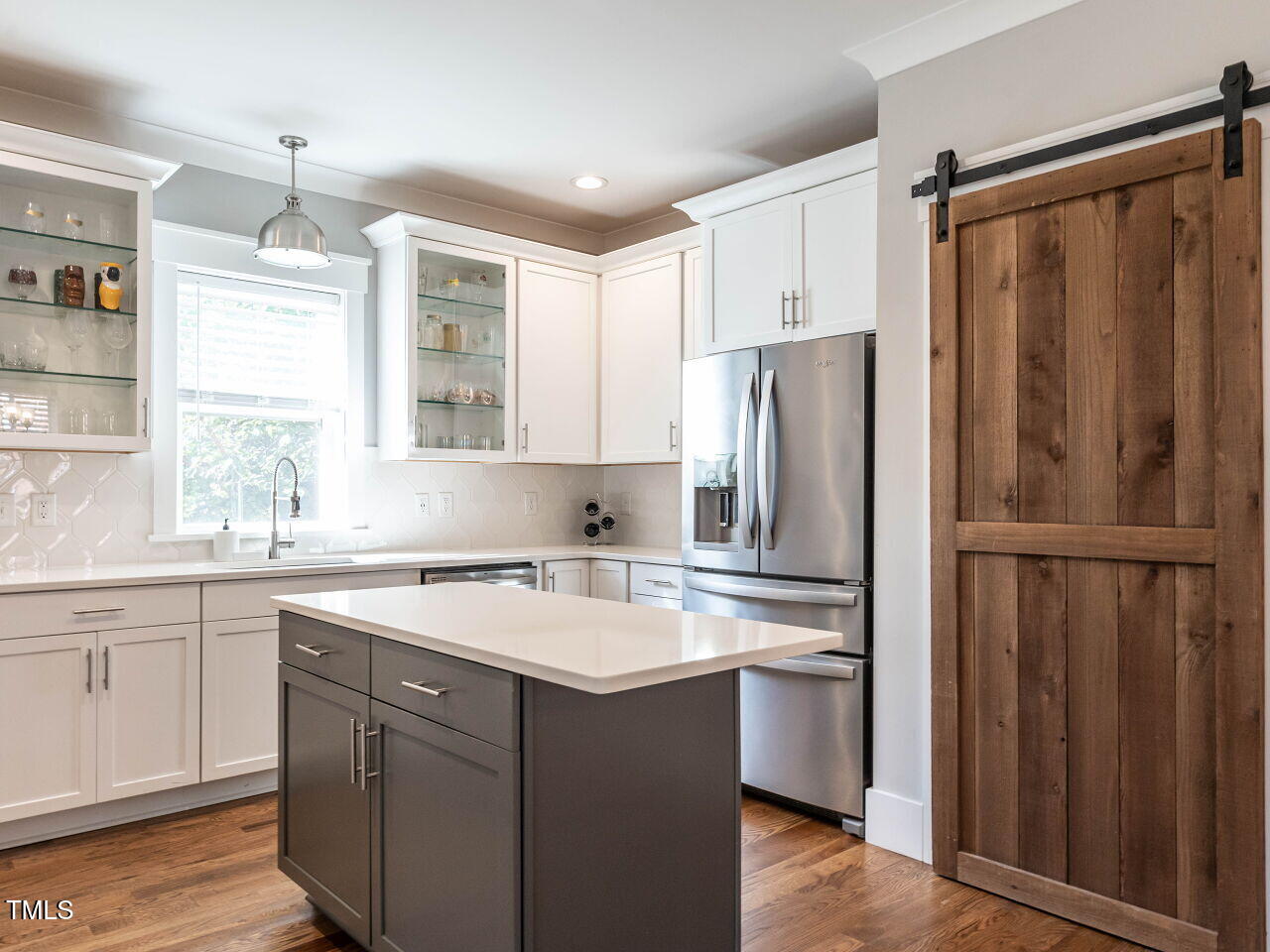 628 Coleman Street Raleigh, NC 27610 - Photo 14 of 38 a kitchen with a refrigerator sink and cabinets