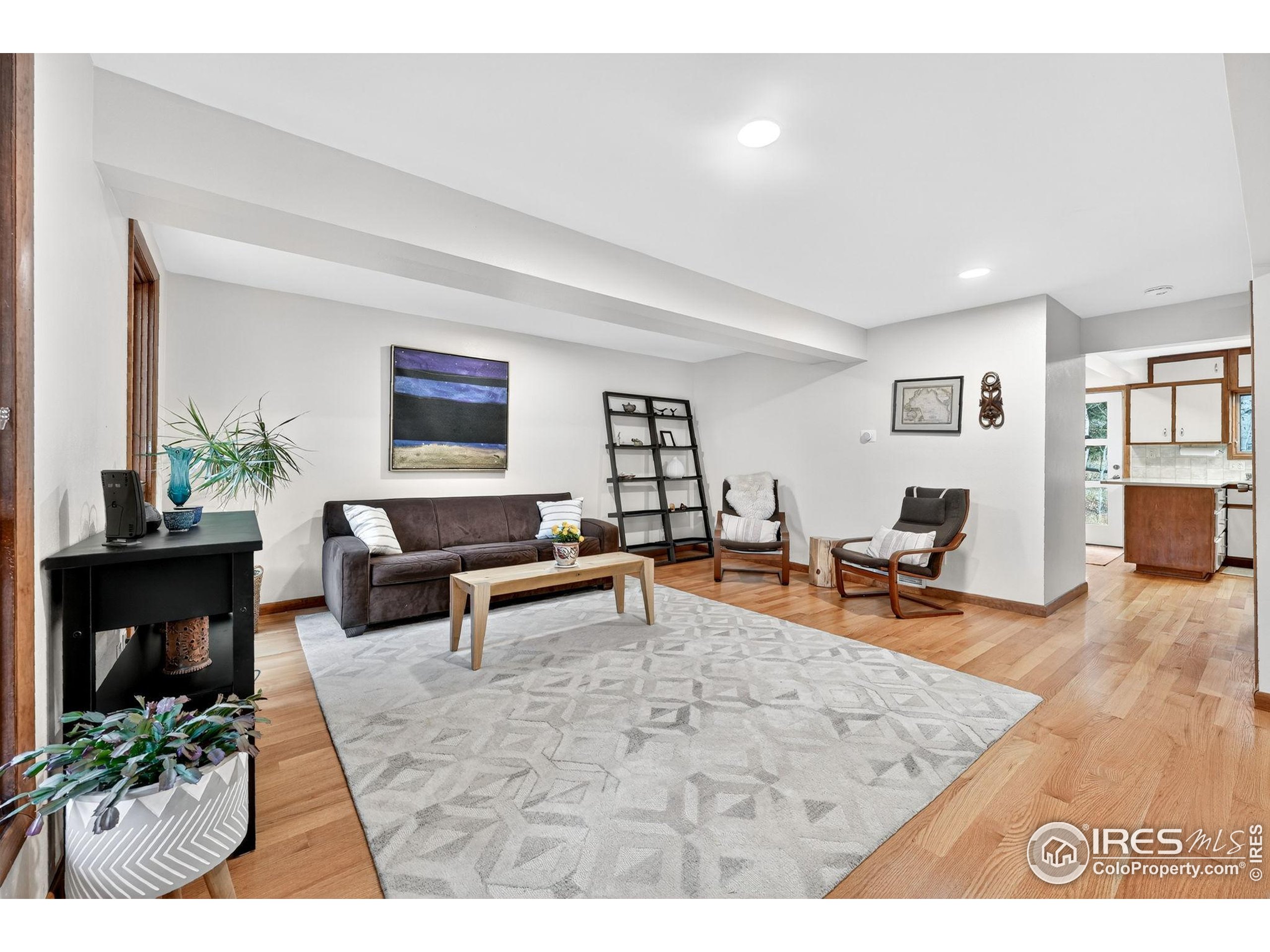 1707 Ridge Road Nederland, CO 80466 - Photo 12 of 50 a living room with furniture and a wooden floor