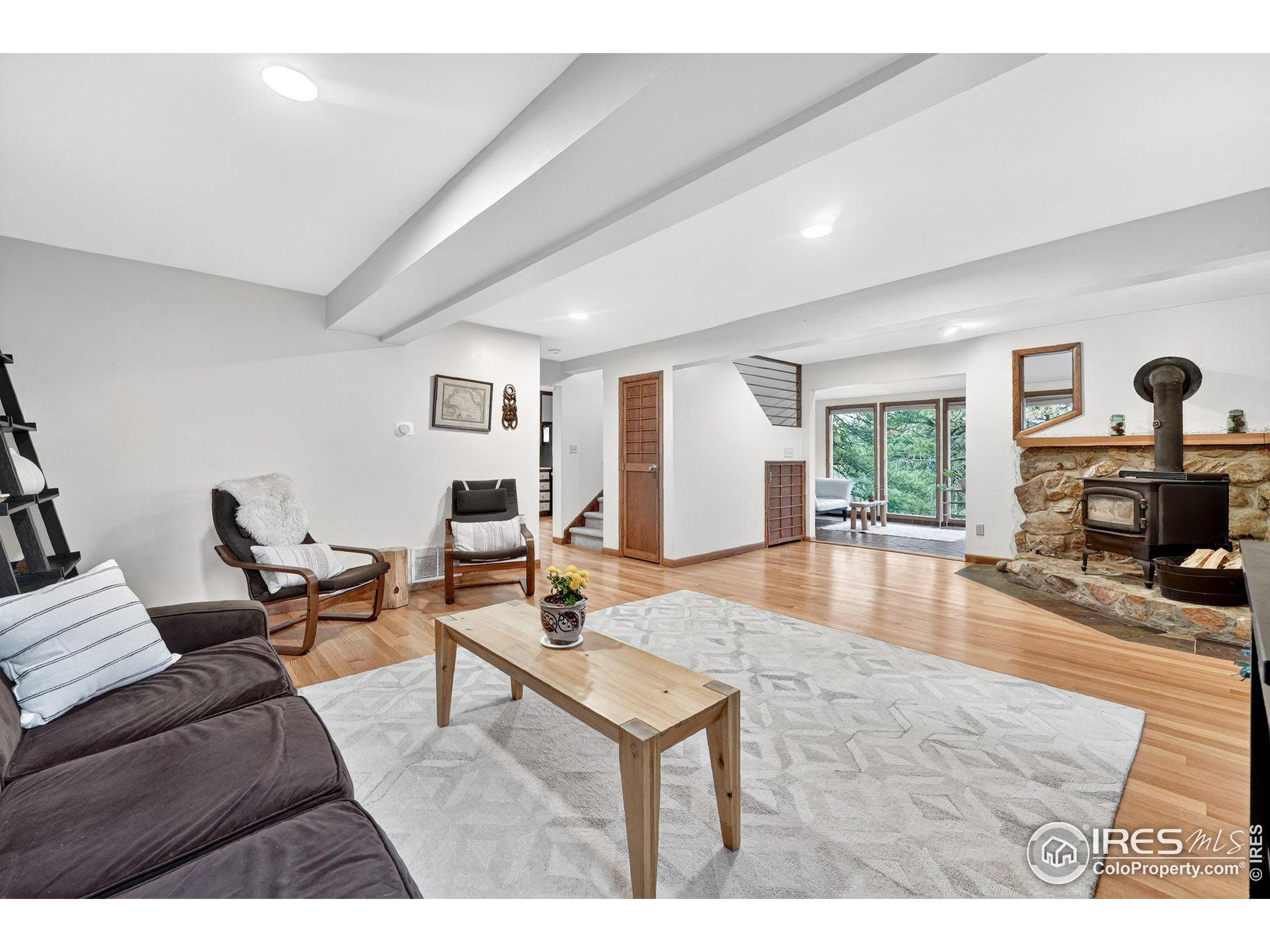 1707 Ridge Road Nederland, CO 80466 - Photo 13 of 50 a living room with furniture and a fireplace