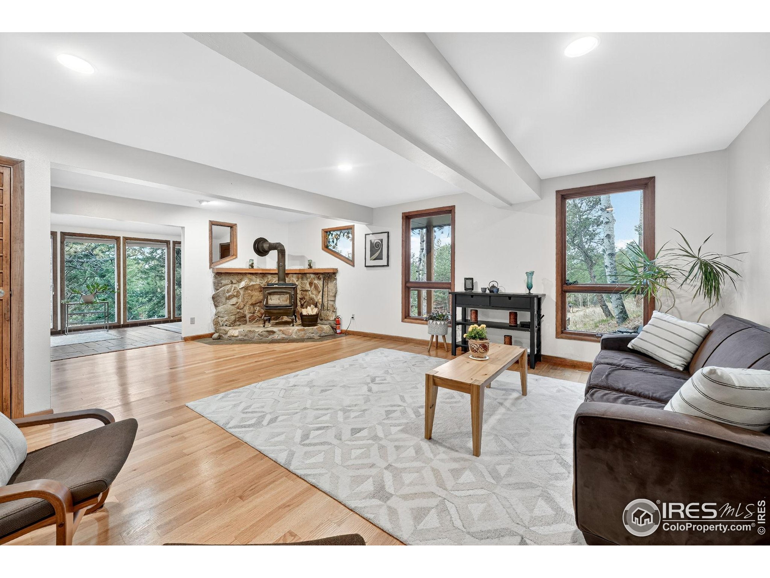 1707 Ridge Road Nederland, CO 80466 - Photo 14 of 50 a living room with furniture and a large window