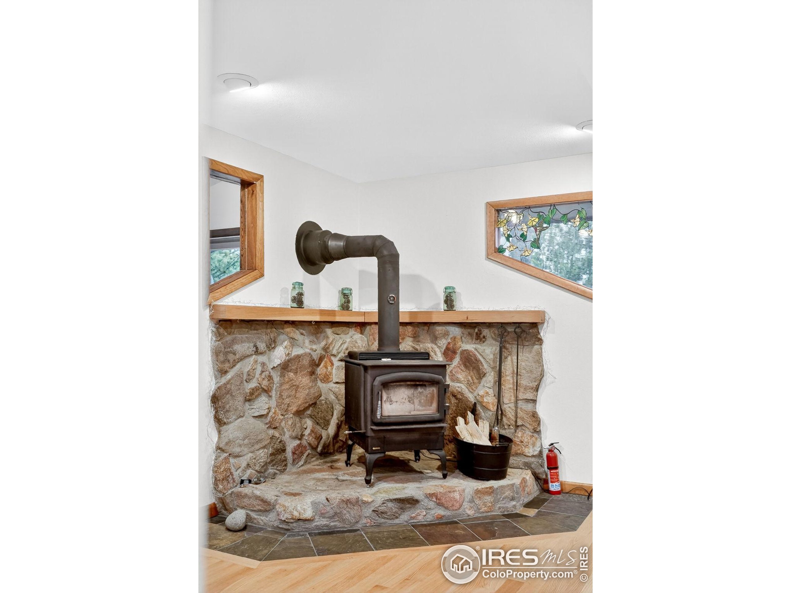 1707 Ridge Road Nederland, CO 80466 - Photo 15 of 50 a room with painting on the wall and a mirror