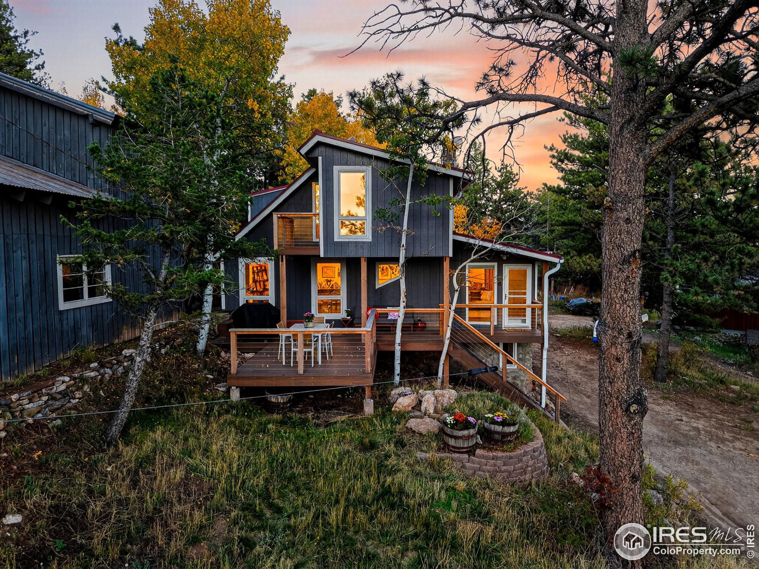1707 Ridge Road Nederland, CO 80466 - Photo 2 of 50 a front view of a house with garden