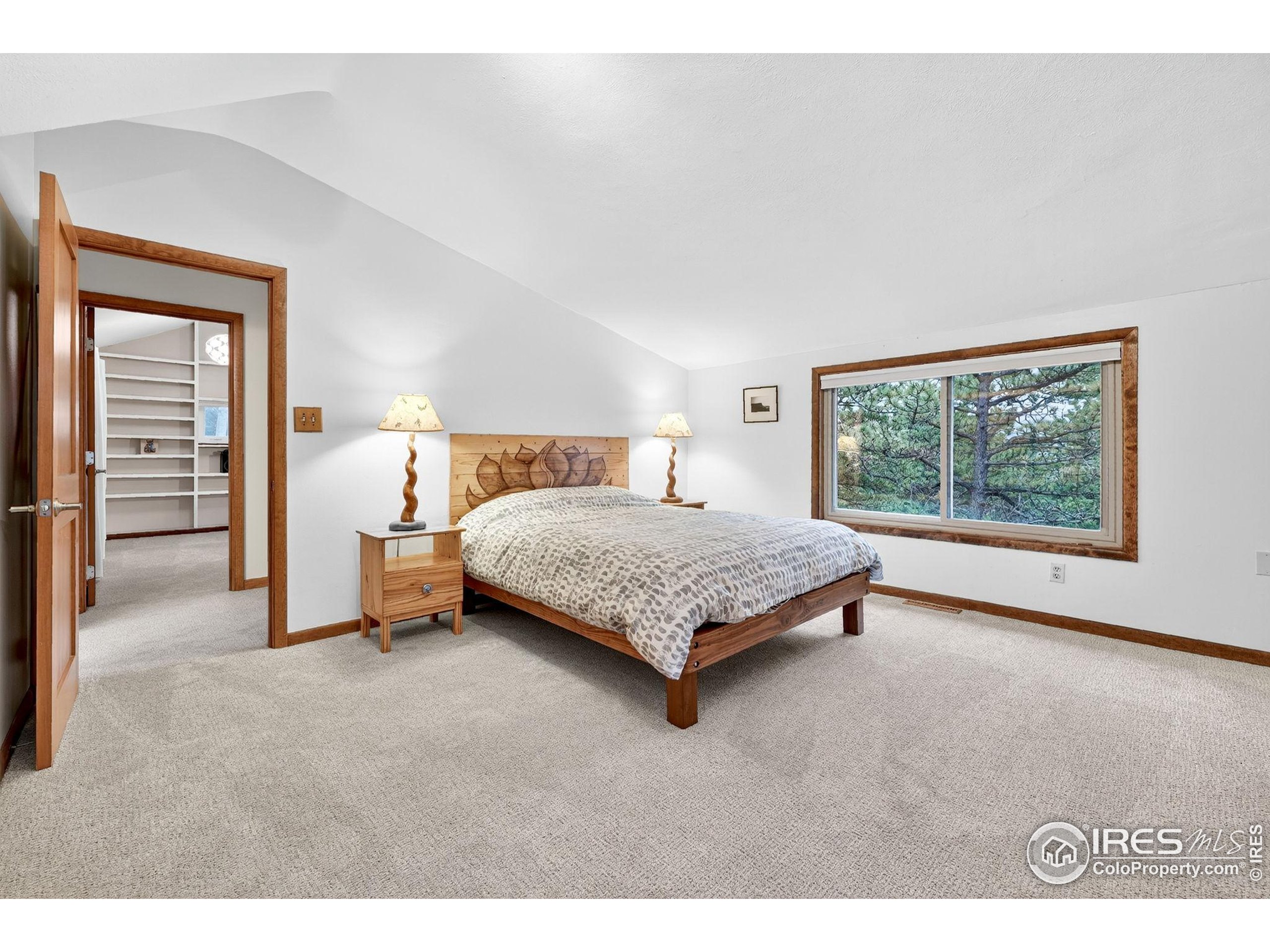 1707 Ridge Road Nederland, CO 80466 - Photo 28 of 50 a bedroom with a bed and a window